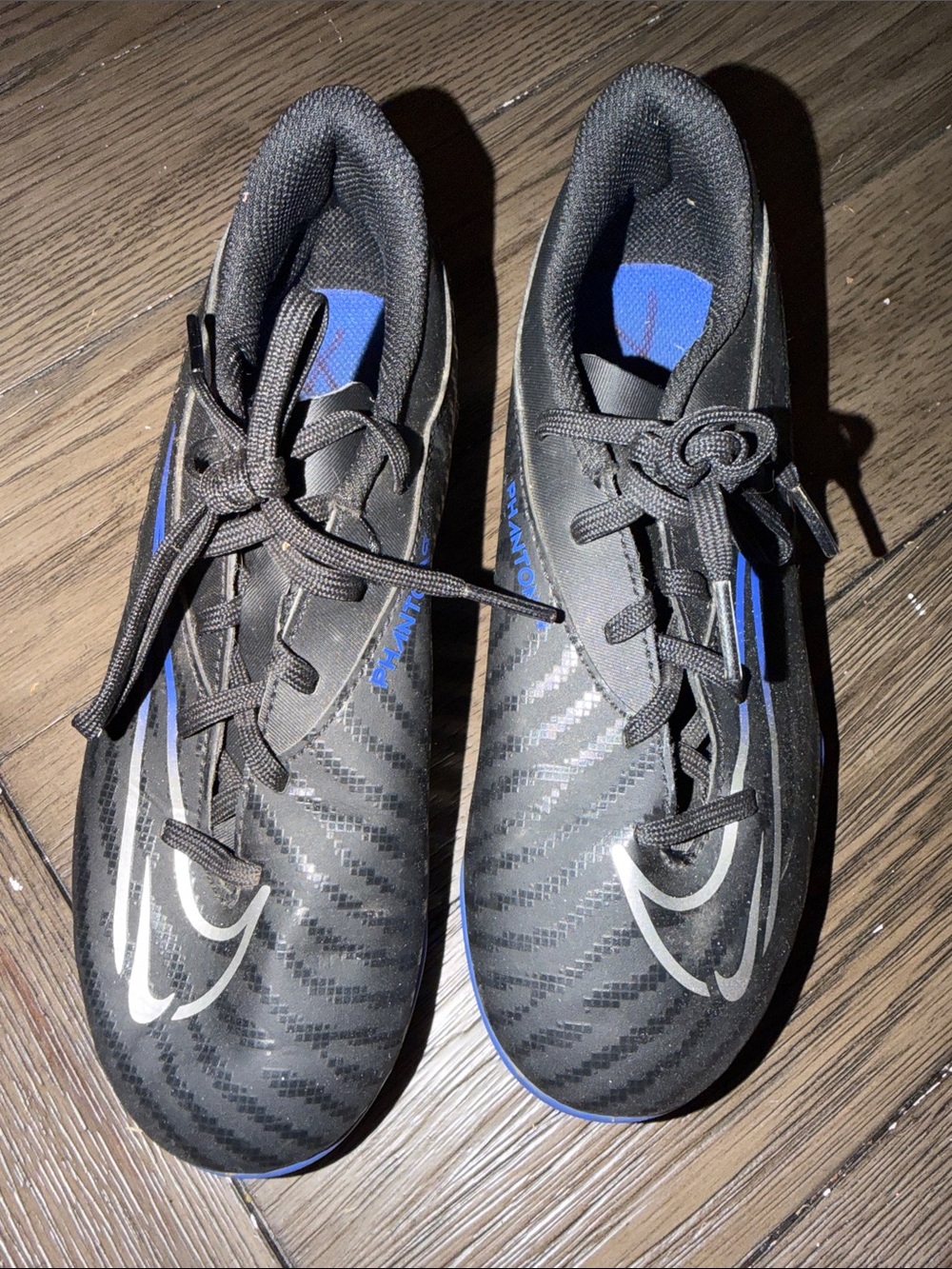 Black Baseball Cleats with Blue Accents and Silver Logo